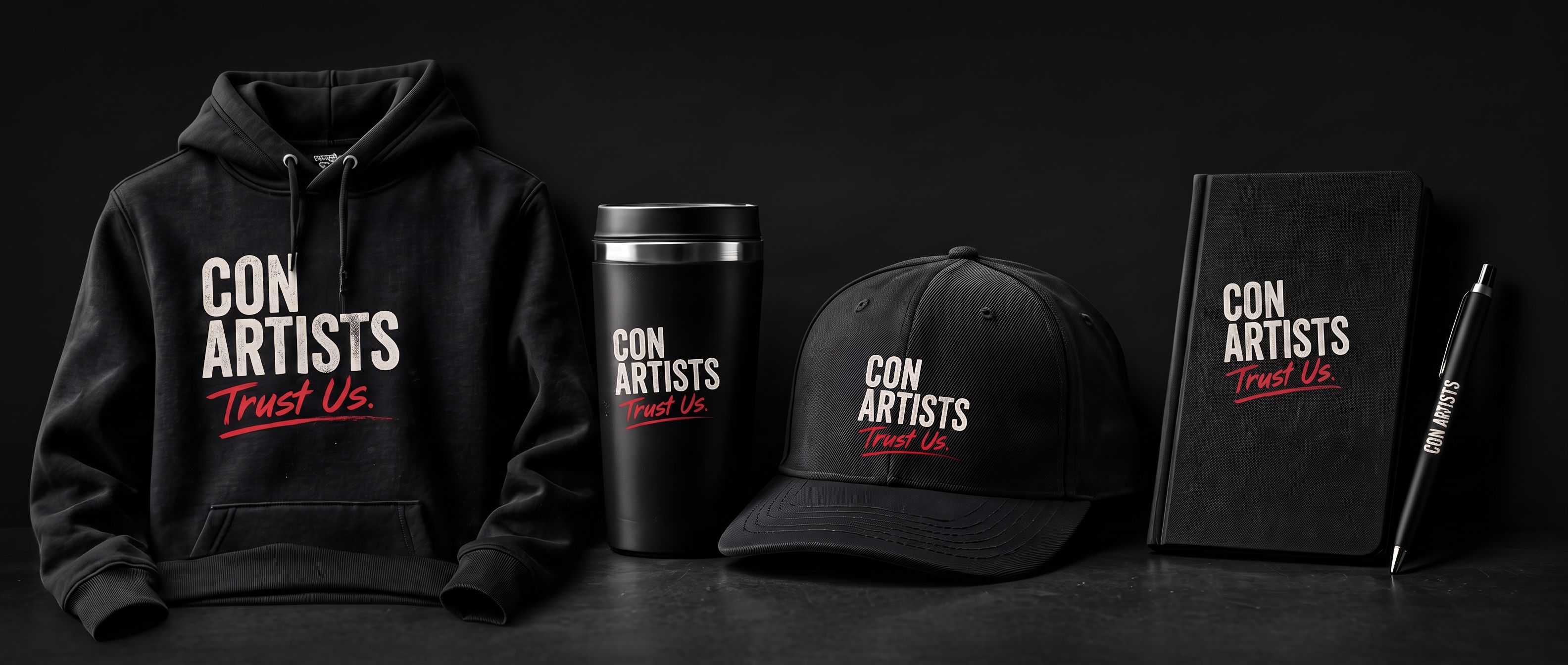 Con Artists merch: a black hoodie, travel tumbler, cap and notebook printed with the “Con Artists — Trust Us.” logo.